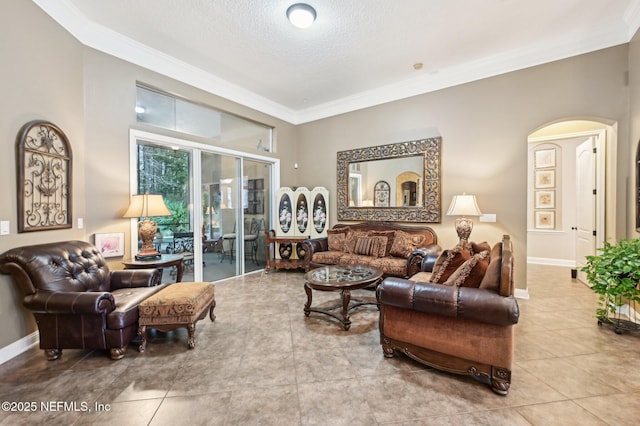 tiled living room featuring a textured ceiling