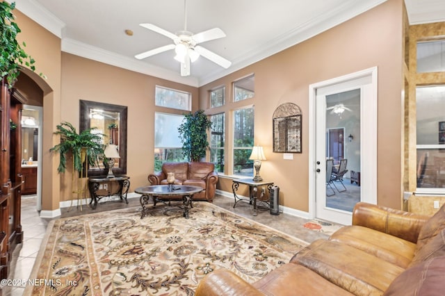 living room featuring light tile patterned floors, crown molding, and ceiling fan