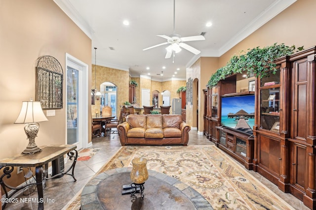 tiled living room with crown molding, vaulted ceiling, and ceiling fan