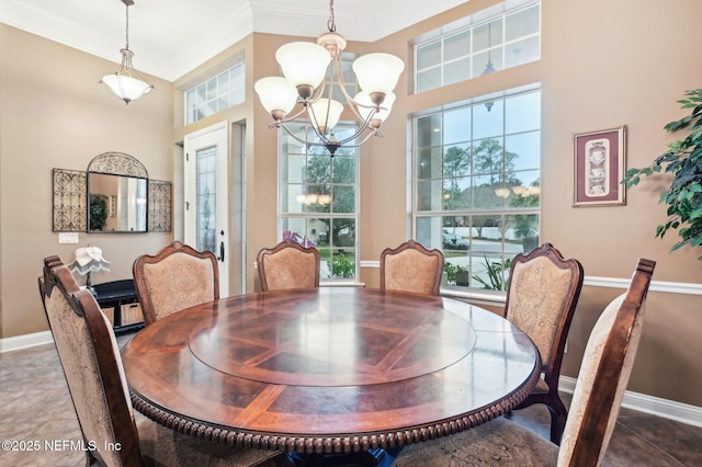 tiled dining area with crown molding and a chandelier