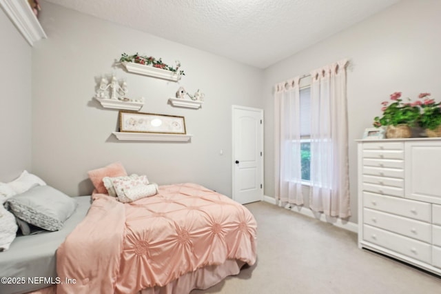 carpeted bedroom with a textured ceiling