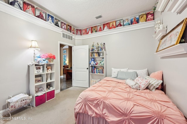 carpeted bedroom with a textured ceiling