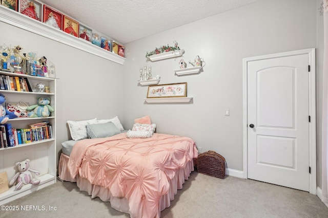 carpeted bedroom with a textured ceiling