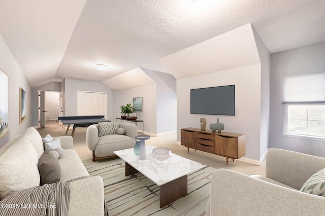 living room featuring light colored carpet, vaulted ceiling, and a textured ceiling