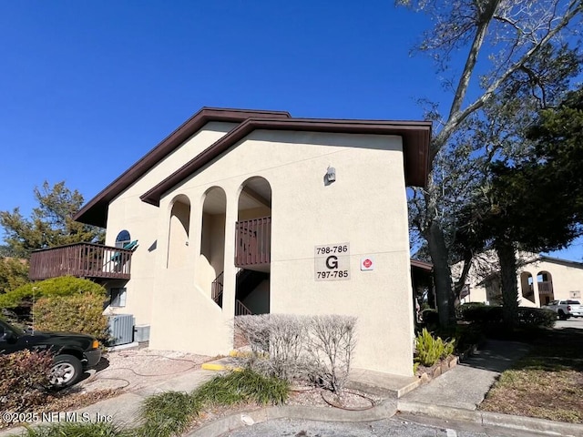 exterior space featuring central AC and a balcony