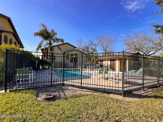 view of swimming pool featuring a patio area