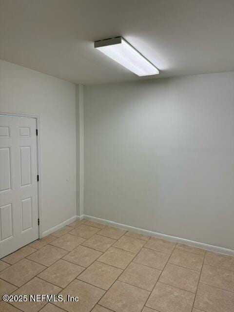 empty room featuring light tile patterned flooring