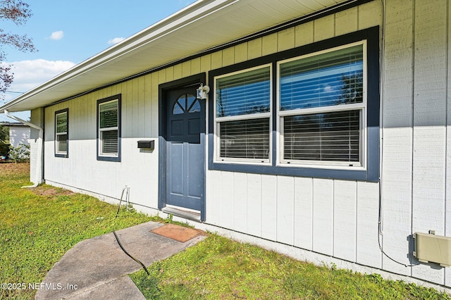 entrance to property with a yard