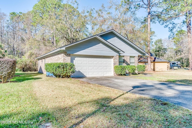 view of home's exterior with a garage and a lawn