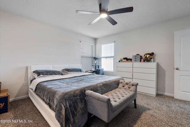 carpeted bedroom with ceiling fan and a textured ceiling