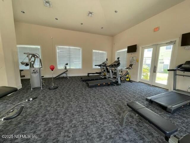 8290 Gate Pkwy W Unit 165, Jacksonville, FL 32216 - exercise room featuring visible vents, french doors, carpet flooring, and a towering ceiling