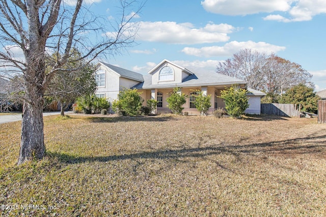 view of front of property featuring covered porch and a front lawn