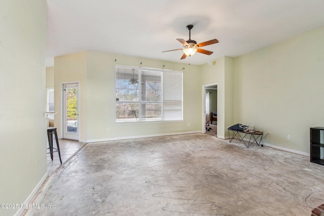 unfurnished living room with ceiling fan