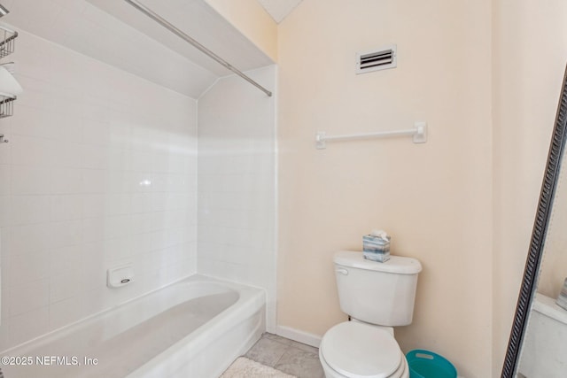 bathroom featuring lofted ceiling, tile patterned floors, shower / bathtub combination, and toilet