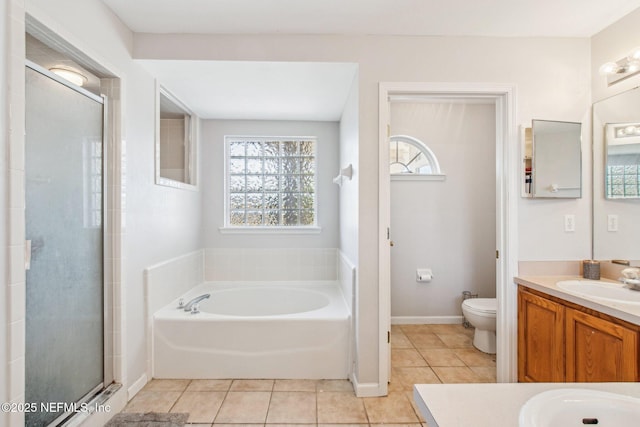 full bathroom featuring tile patterned flooring, vanity, plus walk in shower, and toilet