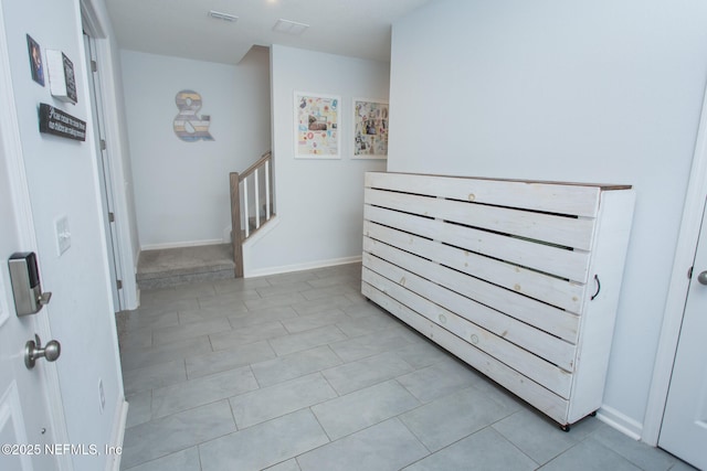 hall with light tile patterned flooring