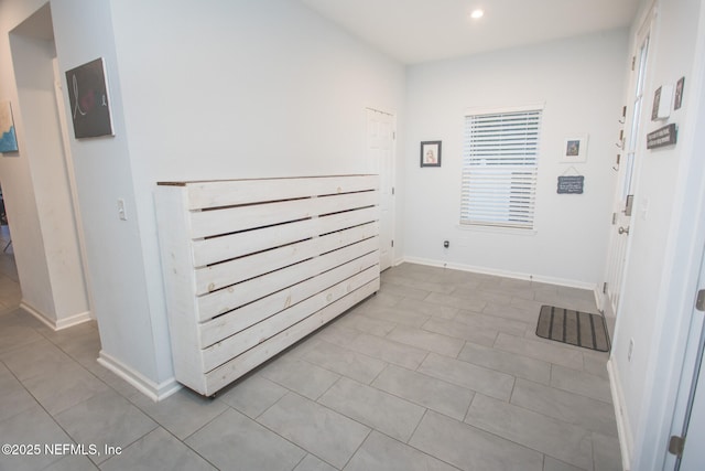 hallway with light tile patterned flooring