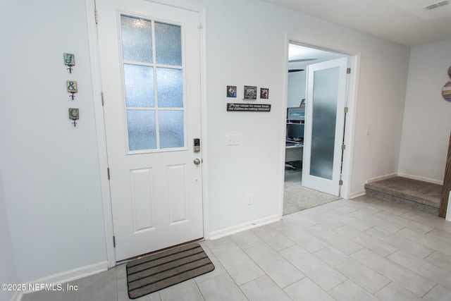 foyer with light tile patterned floors