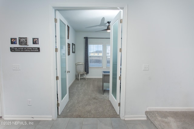 hallway with light carpet