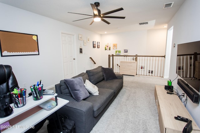 living room featuring carpet floors and ceiling fan