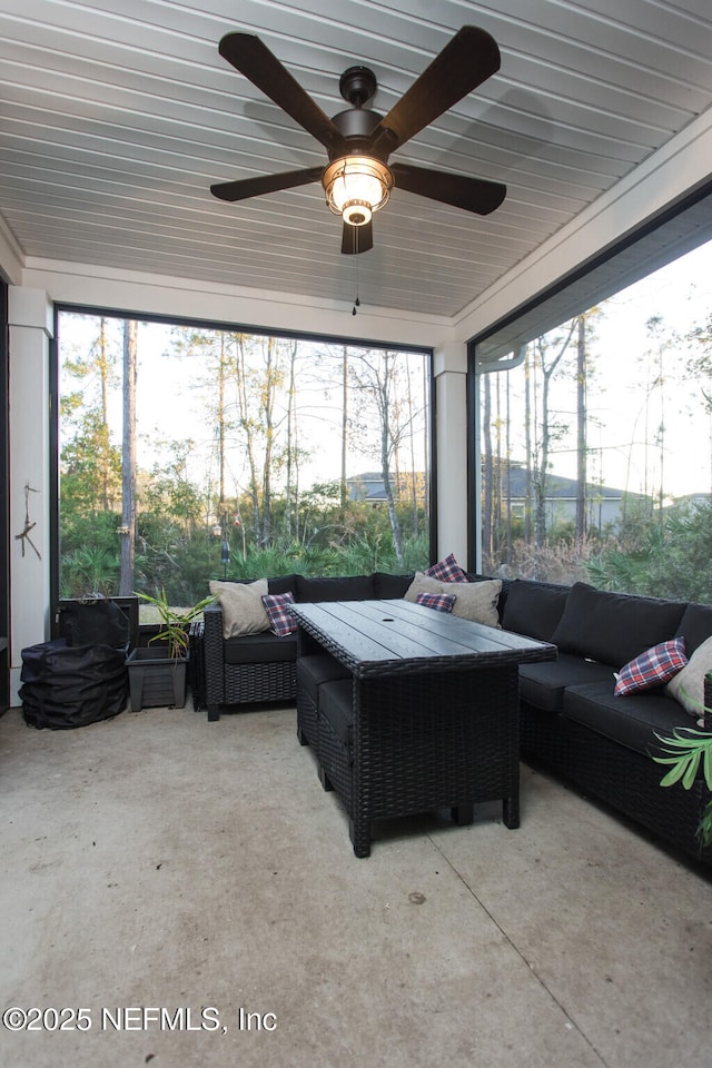 sunroom / solarium with ceiling fan