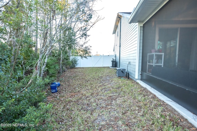 view of yard featuring central air condition unit