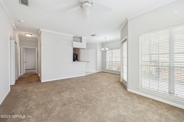 unfurnished living room with light carpet, ceiling fan with notable chandelier, and ornamental molding