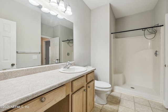 bathroom with walk in shower, vanity, and toilet