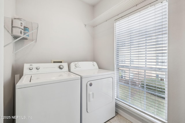 laundry area with washing machine and clothes dryer