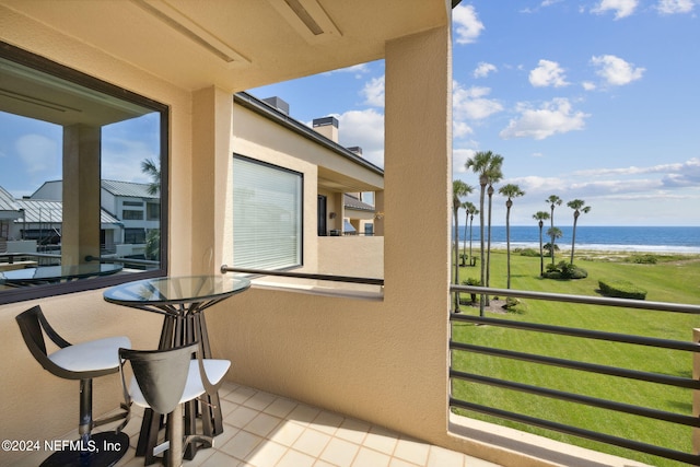 balcony featuring a water view