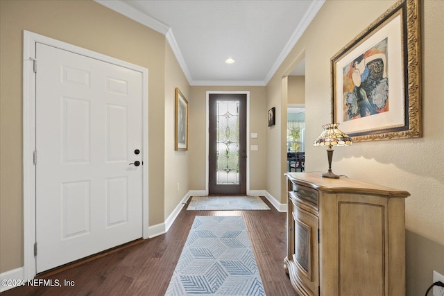 foyer entrance featuring dark wood-type flooring and ornamental molding