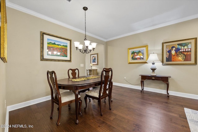 dining space featuring dark hardwood / wood-style flooring, an inviting chandelier, and ornamental molding