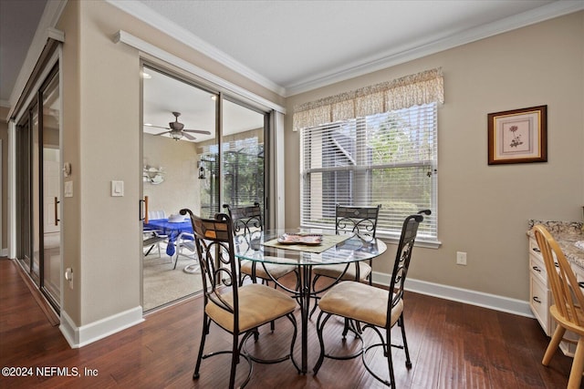 dining room with ceiling fan, dark wood-type flooring, and ornamental molding