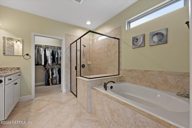 bathroom with vanity and independent shower and bath