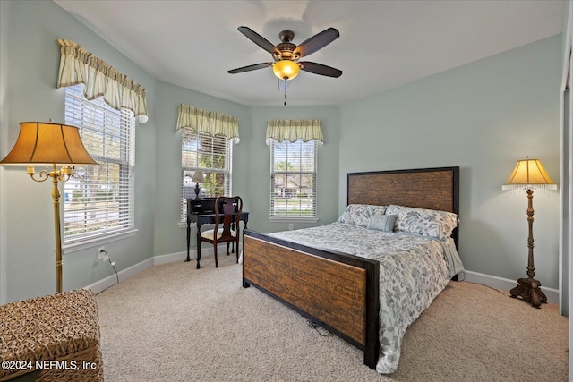 bedroom with light carpet and ceiling fan