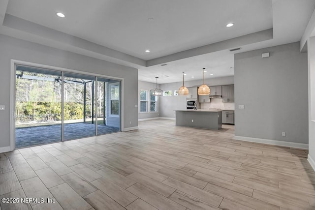 unfurnished living room featuring light wood-type flooring