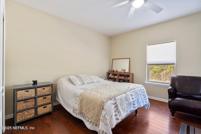 bedroom with ceiling fan and dark wood-type flooring