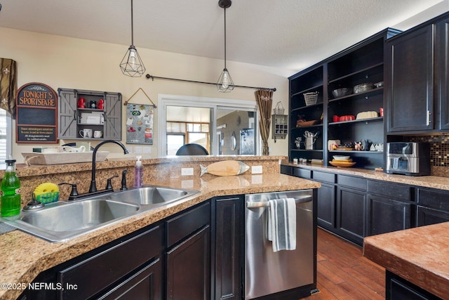 kitchen with pendant lighting, dishwasher, sink, dark hardwood / wood-style floors, and a textured ceiling