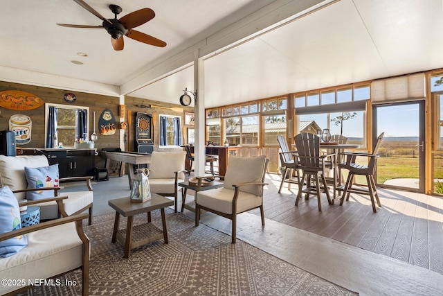 living room featuring ceiling fan and wood-type flooring