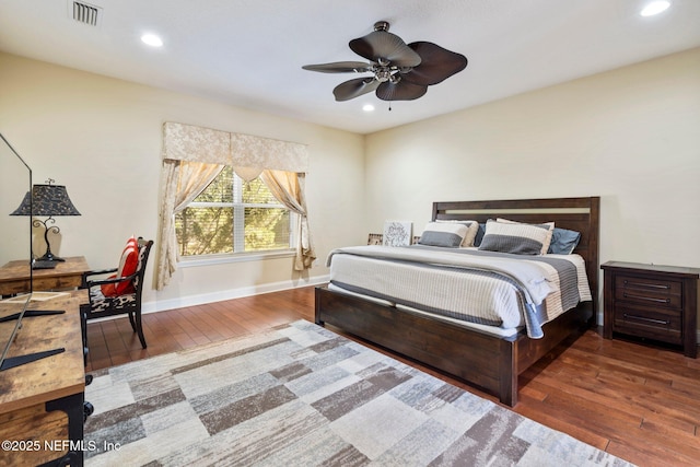 bedroom featuring ceiling fan and hardwood / wood-style flooring