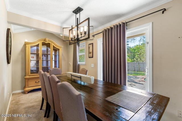 dining area with crown molding, light carpet, and an inviting chandelier