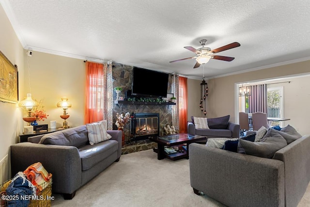 carpeted living room featuring crown molding, ceiling fan, a fireplace, and a textured ceiling