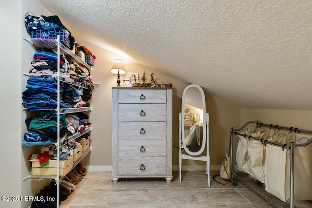 spacious closet featuring vaulted ceiling