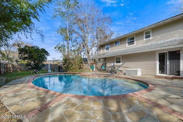 view of swimming pool with a patio