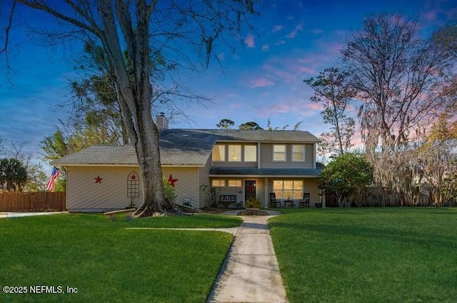 view of front of house with a lawn