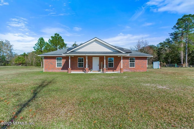 ranch-style home featuring a front yard