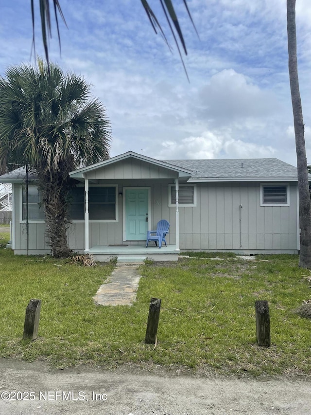 view of front of property with a front lawn and a porch