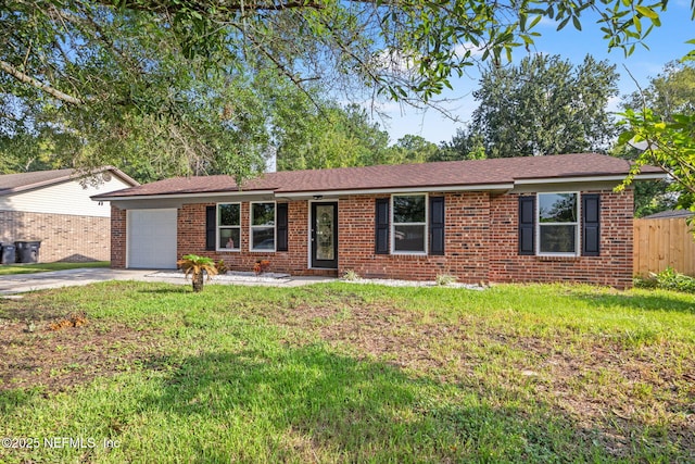 single story home featuring a front lawn and a garage