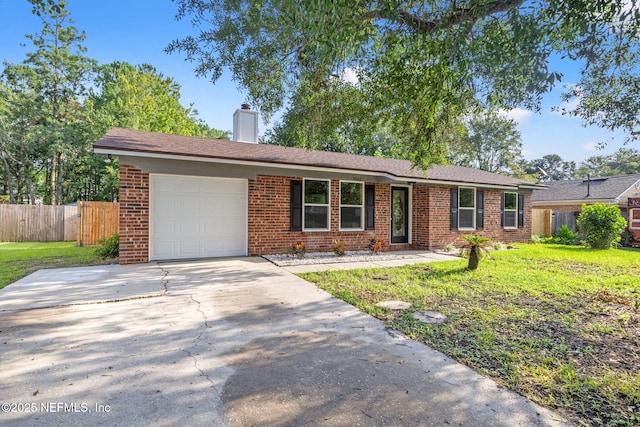 single story home with a garage and a front lawn