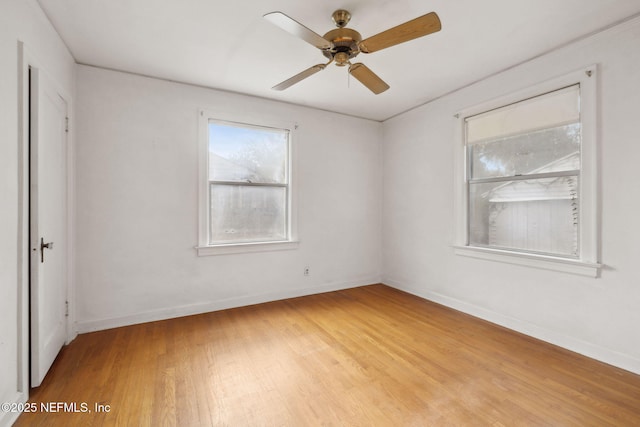 spare room featuring ceiling fan and light hardwood / wood-style floors